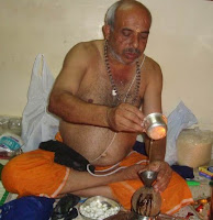 Guruswamy preparing Ghee Filled Coconut to Sabarimala