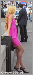 Sexy blonde girl in pink mini-dress