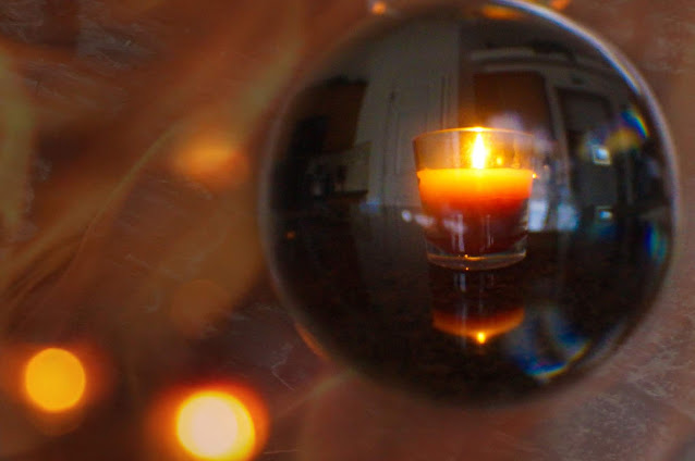 candle through lensball photo by mbgphoto