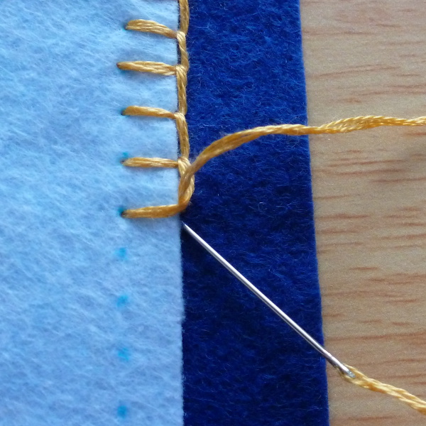 Ending blanket stitch applique on felt fabric