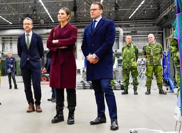 Crown Princess Victoria and Prince Daniel visited the military field hospital. burgundy wool cashmere coat