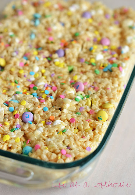 These Rice Krispie Treats are loaded with mini marshmallows, plain M&M's and topped with sprinkles. Life-in-the-Lofthouse.com