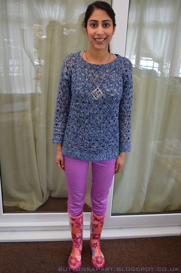 a picture of an outfit featuring a blue knitted jumper, lilac skinny jeans and wellington boots