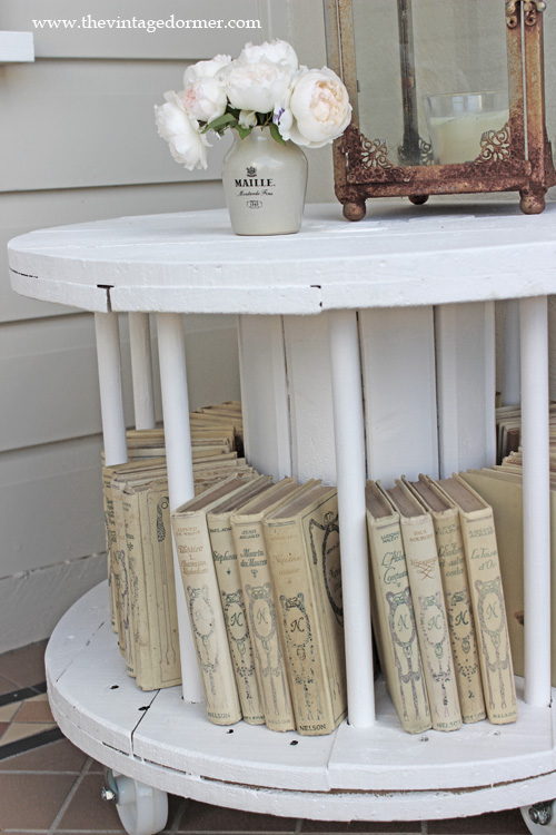 This spool table bookshelf is perfect for a living room or reading room