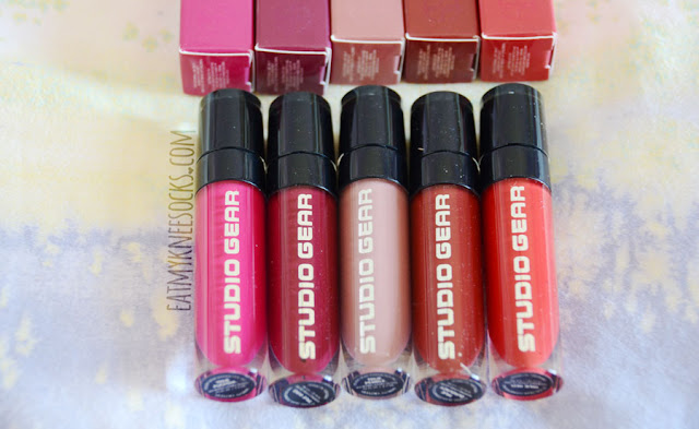 Details on the True Whipped Stain Gloss liquid lip glosses from Studio Gear Cosmetics, available in pebble, fuschia, red, burgundy, and wine.