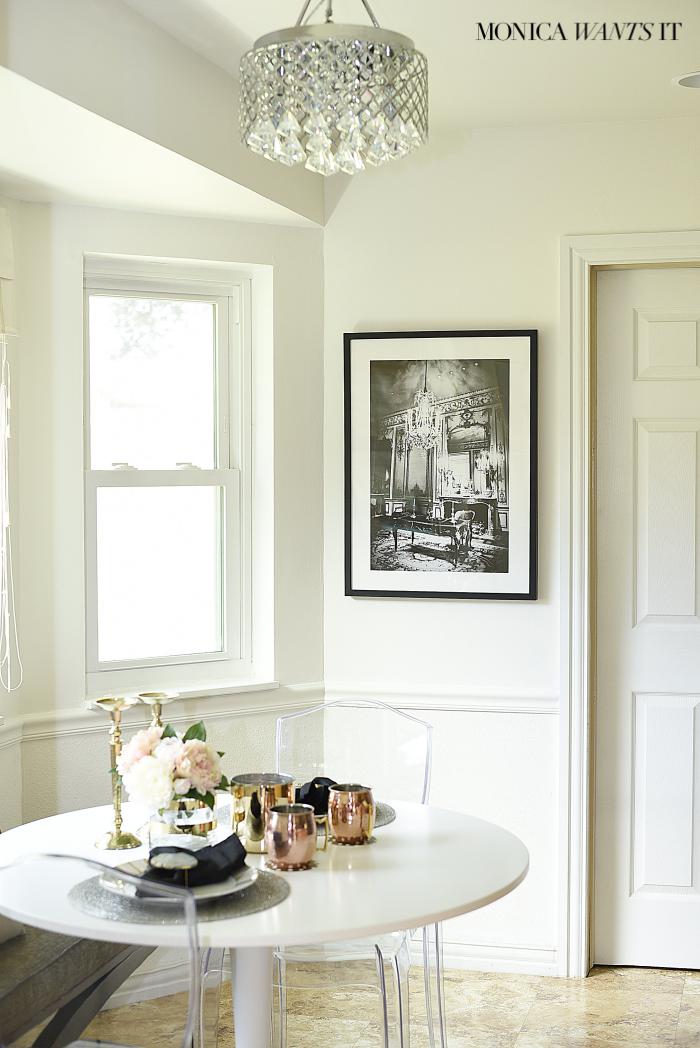 This is a beautifully made over breakfast nook. It's chic, sophisticated and feminine. 