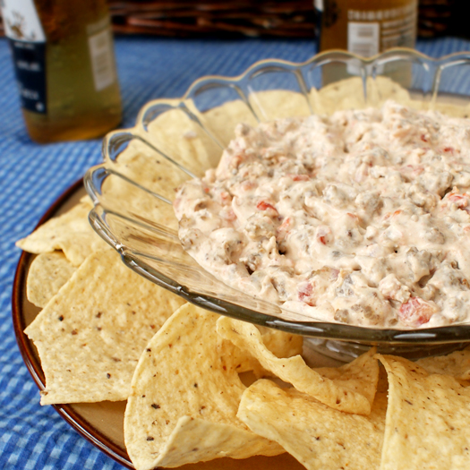 Sausage Cream Cheese Dip is a creamy, spicy, addictive sausage dip that takes just minutes to throw together. #sausagedip #appetizerrecipes #cheesedip