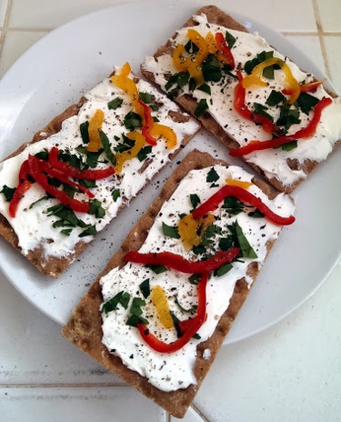 crispbread with cream cheese, pickled peppers, and parsley