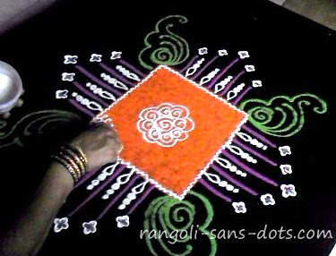 intermediate stage of the rangoli on the right rangoli-design-free-hand-0611b.jpg