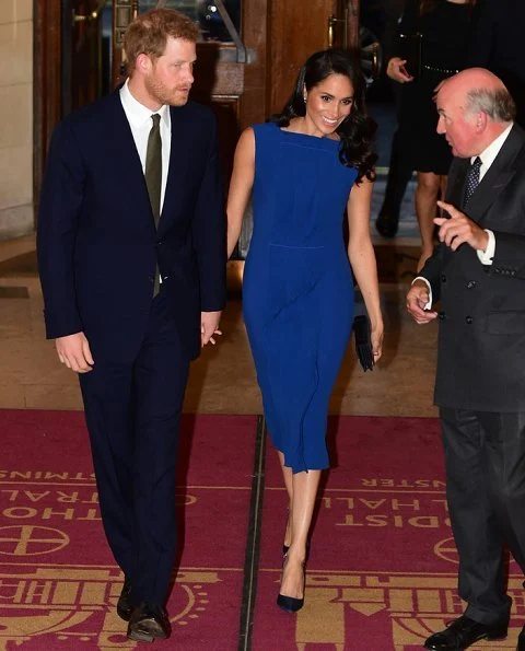 Meghan Markle wore a royal blue midi dress by Jason Wu, Aquazzura Portrait Lady pumps, she carries DIOR Navy Satin Clutch Bag