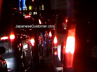 Red Tailights in Tokyo traffic copyright peter hanami 2010