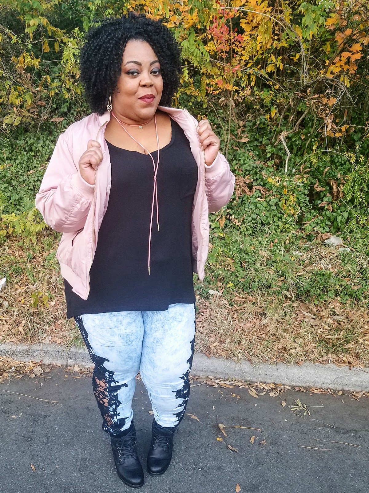 Plus size blogger with thick thighs and round hips in statement jeans, pink bomber, faux suede tie necklace and stacked booties Plus size blogger with thick thighs and round hips in statement jeans, pink bomber, faux suede tie necklace and stacked booties