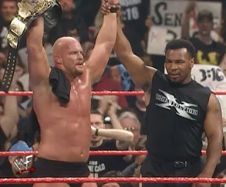 WWE / WWF - Wrestlemania 14 Review  -  Mike Tyson celebrates with new WWF Champion Stone Cold Steve Austin