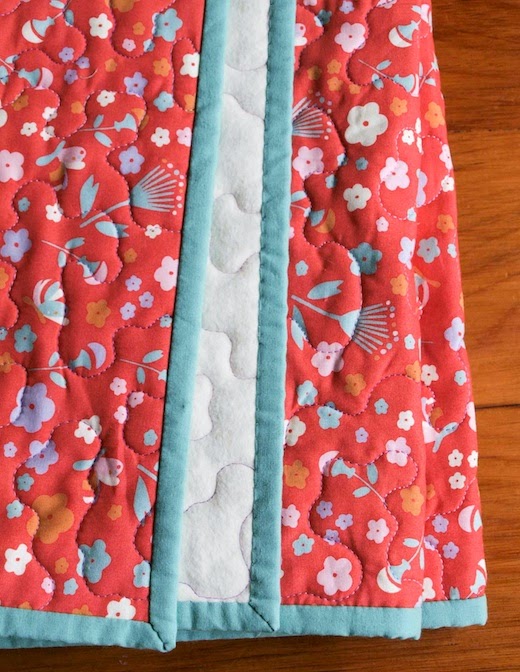 Floral whole-cloth organic baby quilt