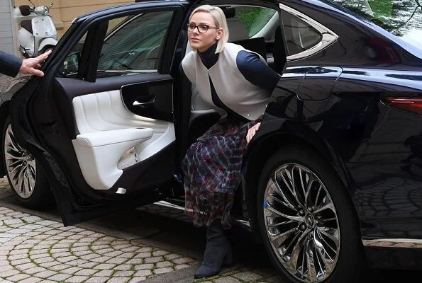 Charlene wore a print tiered georgette peasant paisley midi skirt by Lauren Ralph Lauren and Akris sleeveless wool shift dress