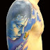 Butterfly and blue boy tattoo on arm and shoulder