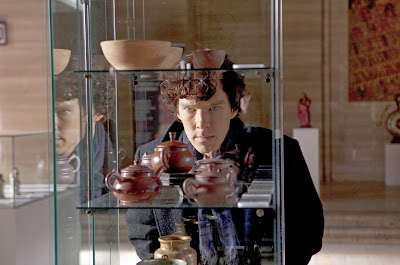 Benedict Cumberbatch as Sherlock Holmes studying Chinese Ming pottery in BBC Sherlock Season 1 Episode 2 The Blind Banker