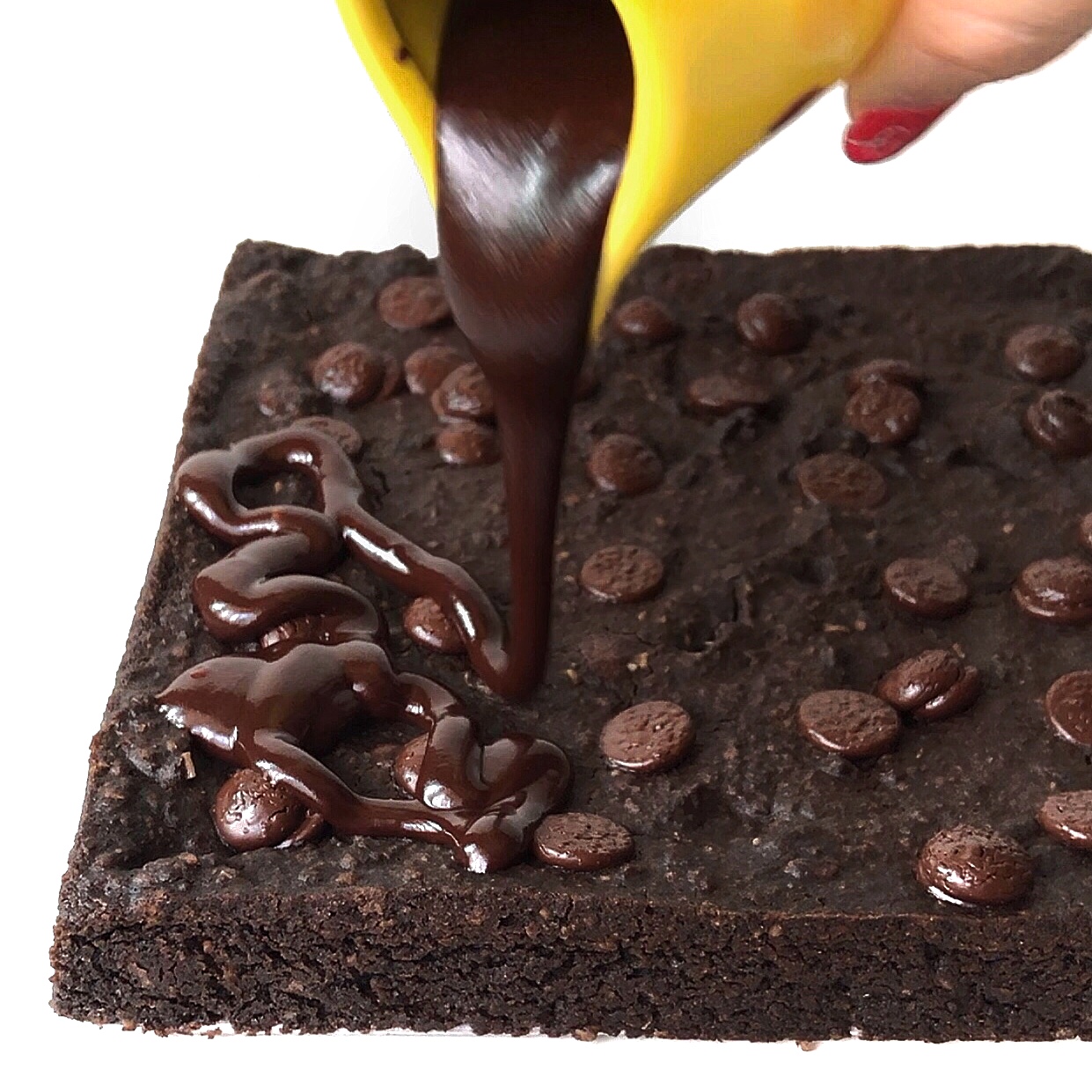 Adding Chocolate ganache to brownies