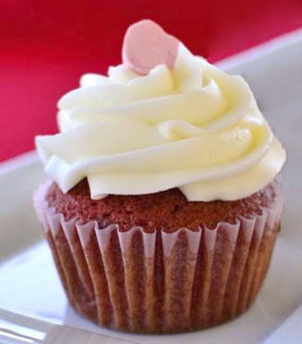 Red Velvet Cupcakes: Classic red batter cupcake topped with cream cheese frosting and a candy heart for Valentine's day/