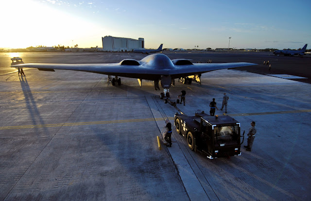 A B-2 Spirit is towed to a parking spot Feb. 12 at Hickam Air Force Base, Hawaii
