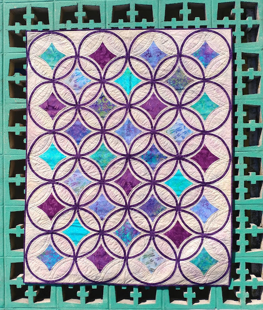 Moonrise quilt by Slice of Pi Quilts using Lavendula fabrics by Island Batik