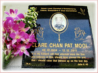 Marbled plaque covering the niche of the late Clare Chan