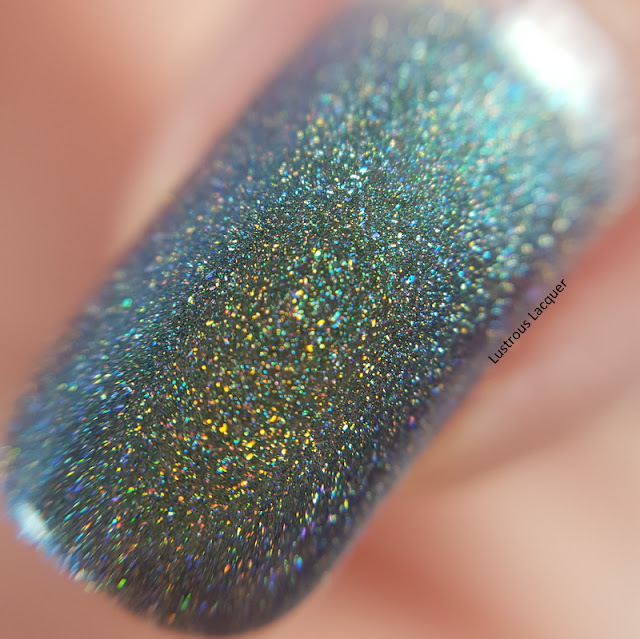 Deep-moss-green-to-Emerald-green-duochrome-nail-polish-with-scattered-holographic-glitter