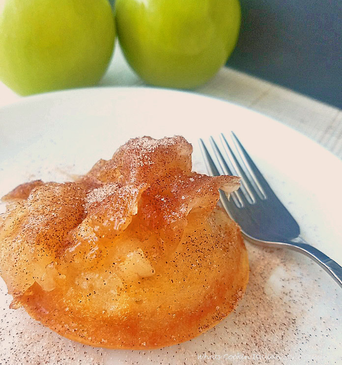 this is how to make an apple individual upside down cake on a white plate with a fork