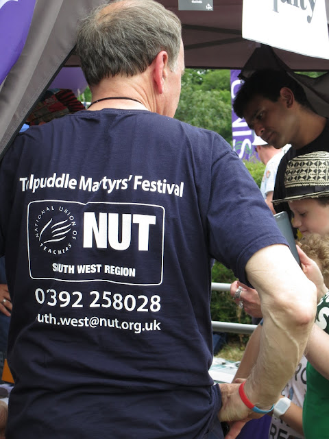 Back of man in NUT South West T-shirt at Tolpuddle Martyr's Festival 2016