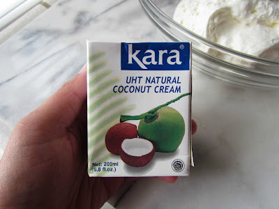 Woman holding a box of coconut cream