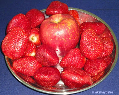 washed strawberries and apple