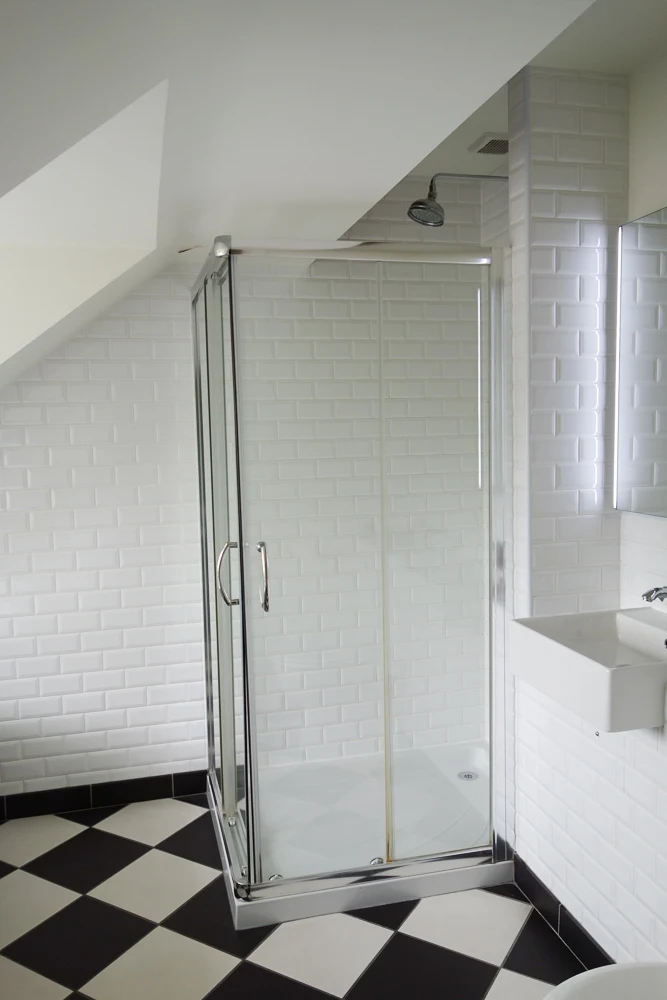 Shower with white tiles
