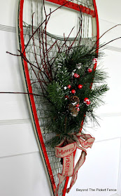 use twigs and pine garland to make an easy Christmas decoration