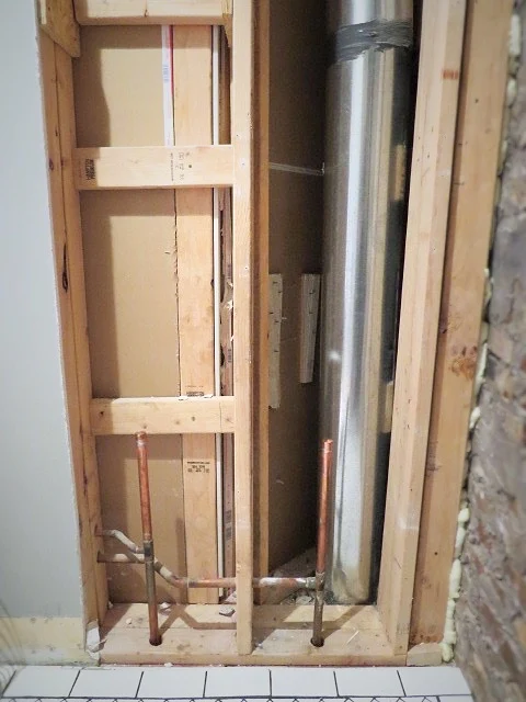 exposed plumbing in main floor bathroom