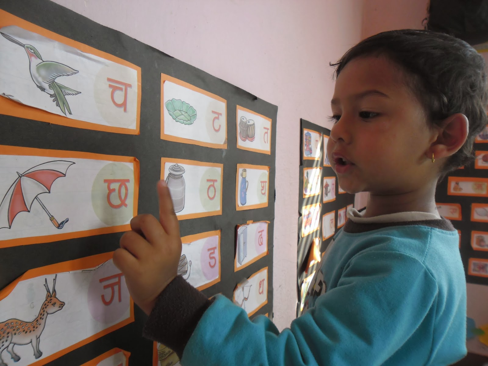 Happy Crayons School Teaching Nepali Alphabets to beginners Nursery
