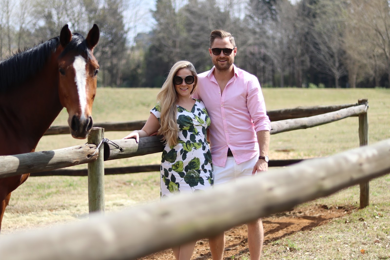 Katie Heath and Ben Heath wearing green and white dress with a horse at Ardmore Ceramics, South Africa