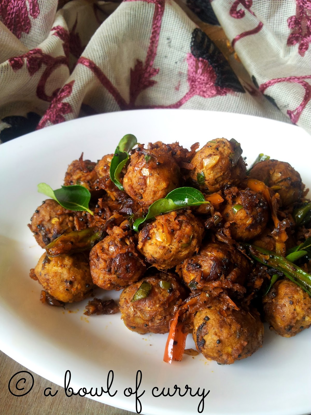 A Bowl Of Curry Chicken Balls Pepper Fry