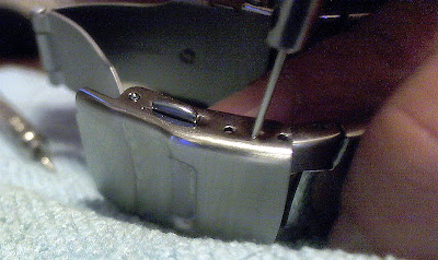 Using Pin Punch to remove spring bar from watch bracelet clasp