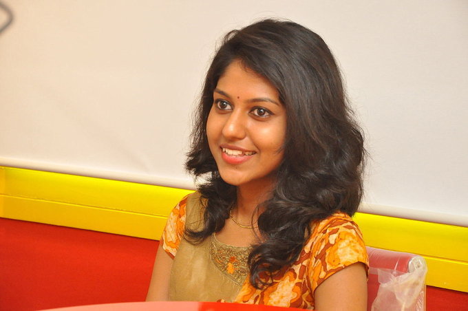 Glamours Telugu Singer Madhu Priya Photo shoot In Orange Dress