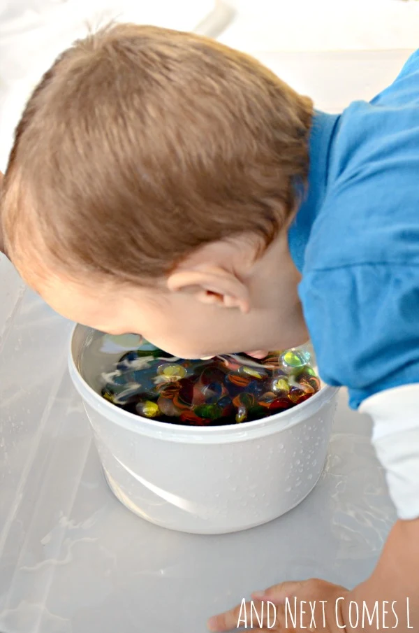 Water sensory play for toddlers and preschooelrs with glass stones from And Next Comes L