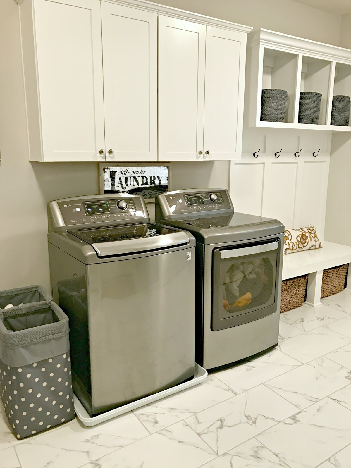 Our Mud Room Laundry Room Combo This Time I Love It From Thrifty Decor Chick Sunken laundry room and mudroom combo feature gray cabinets with brass pull and a vintage wall mount sink faucet beside a subway tiled dog tub. our mud room laundry room combo this