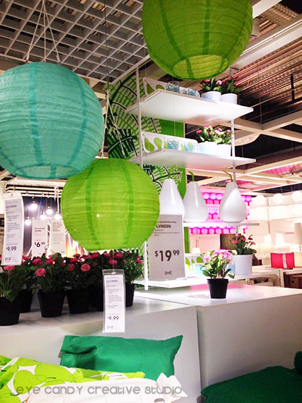 outdoor solar lights, paper lanterns, potted flowers, outdoor pillows