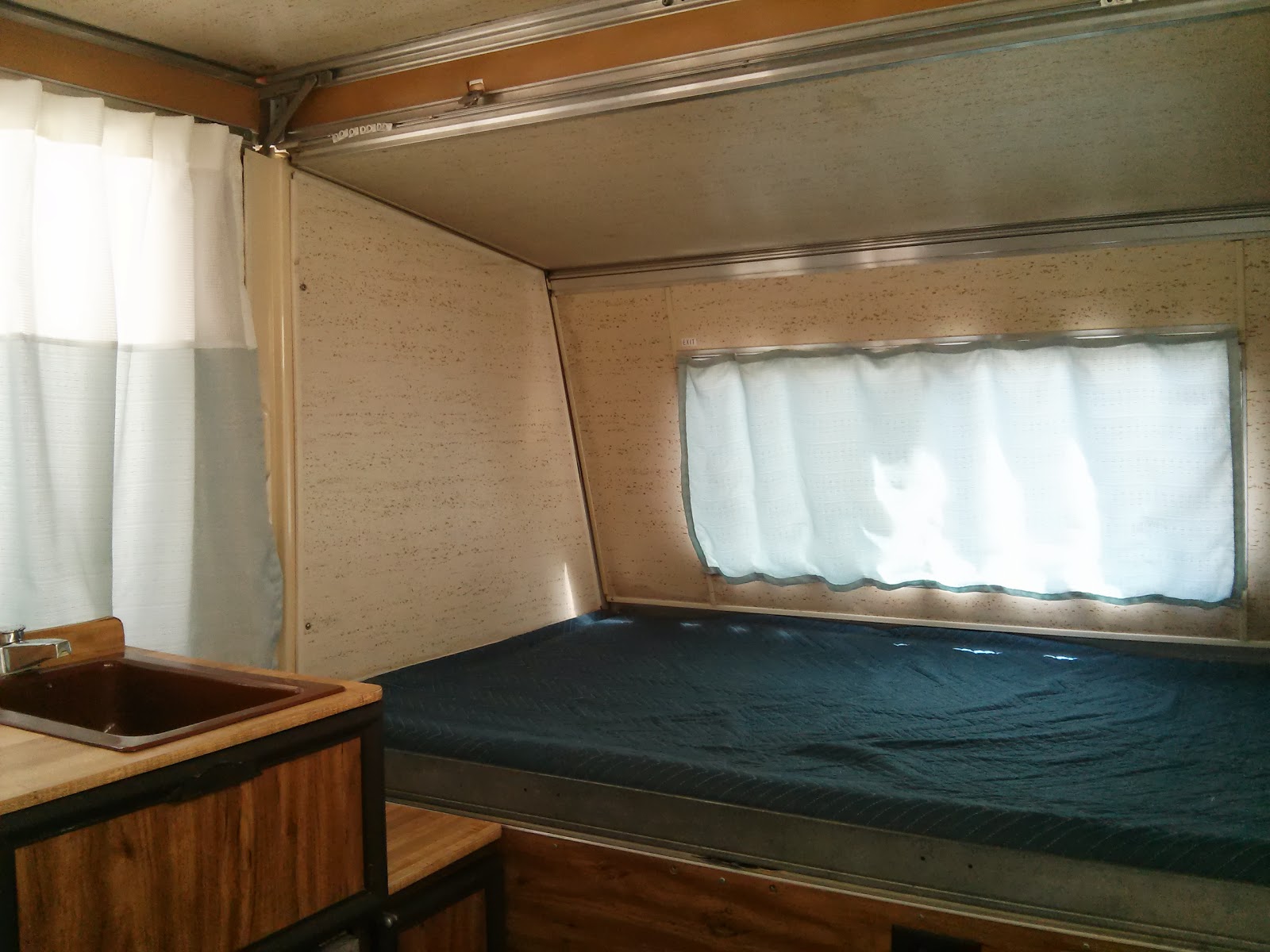 Light blue curtains in Apache camper update