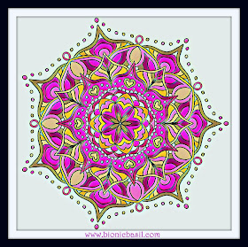 beautiful mandala coloured in greens pinks and golds