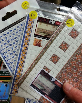 A 1/35 scale wall tile sets on display on a stand at a scale model exhibition.