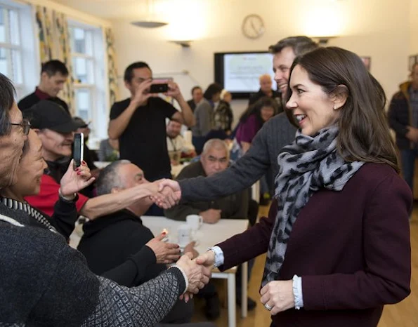 Crown Prince Frederik and Crown Princess Mary visited  the Morning Café for the Homeless (Morgencafé for Hjemløse). Princess Mary wore Prada jacket, Gianvito Rossi pumps