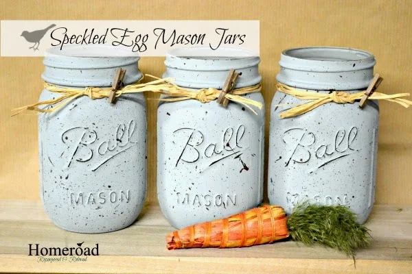 Three speckled mason jars with carrot