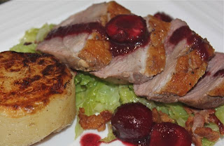 Delicious duck with cherry sauce, fondant potato and savoy cabbage