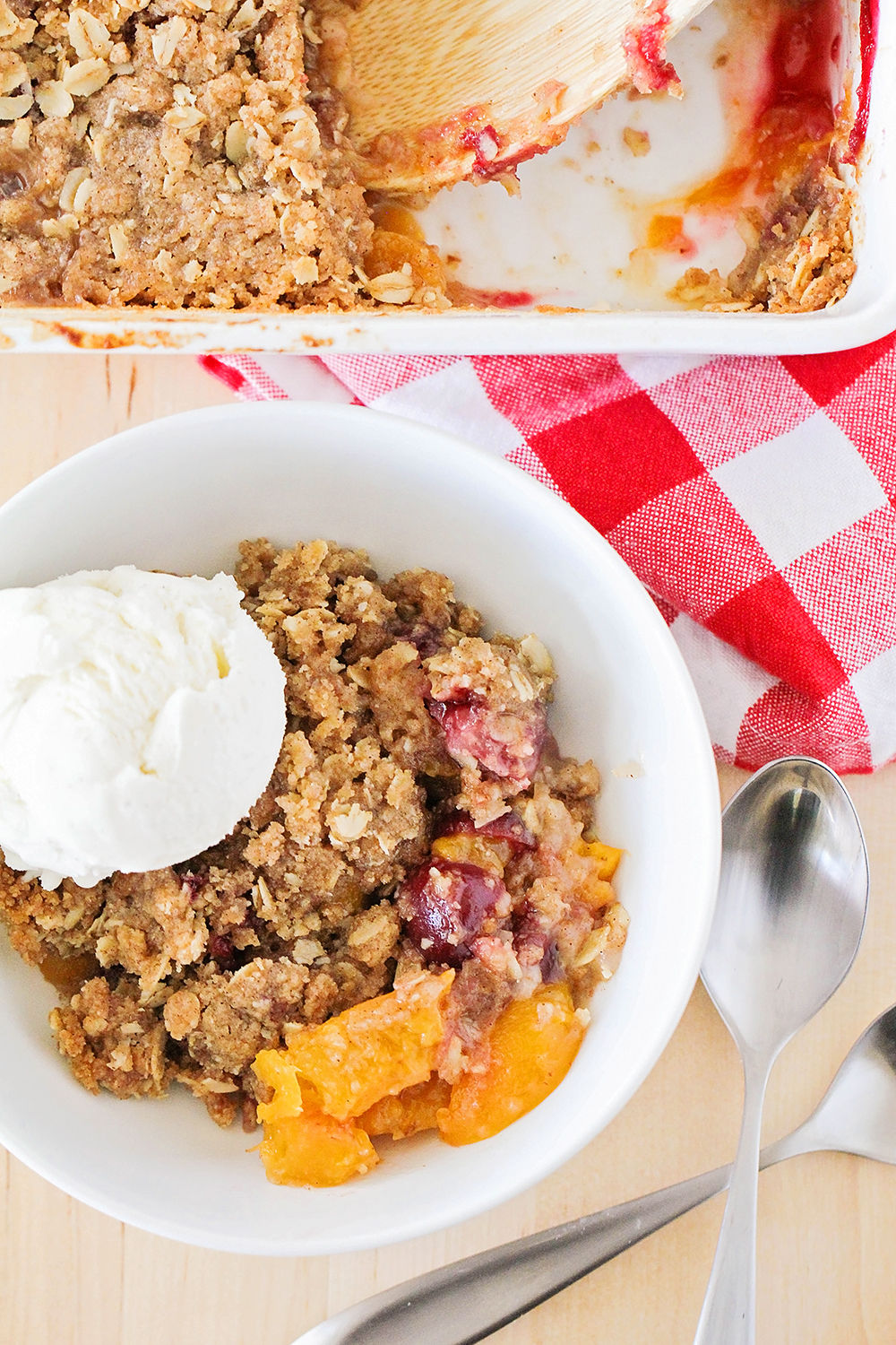 This cherry peach crisp is full of juicy summer fruit, and so easy to make. It's the perfect summer dessert!