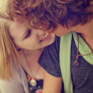 boy and girl in love smiling kissing